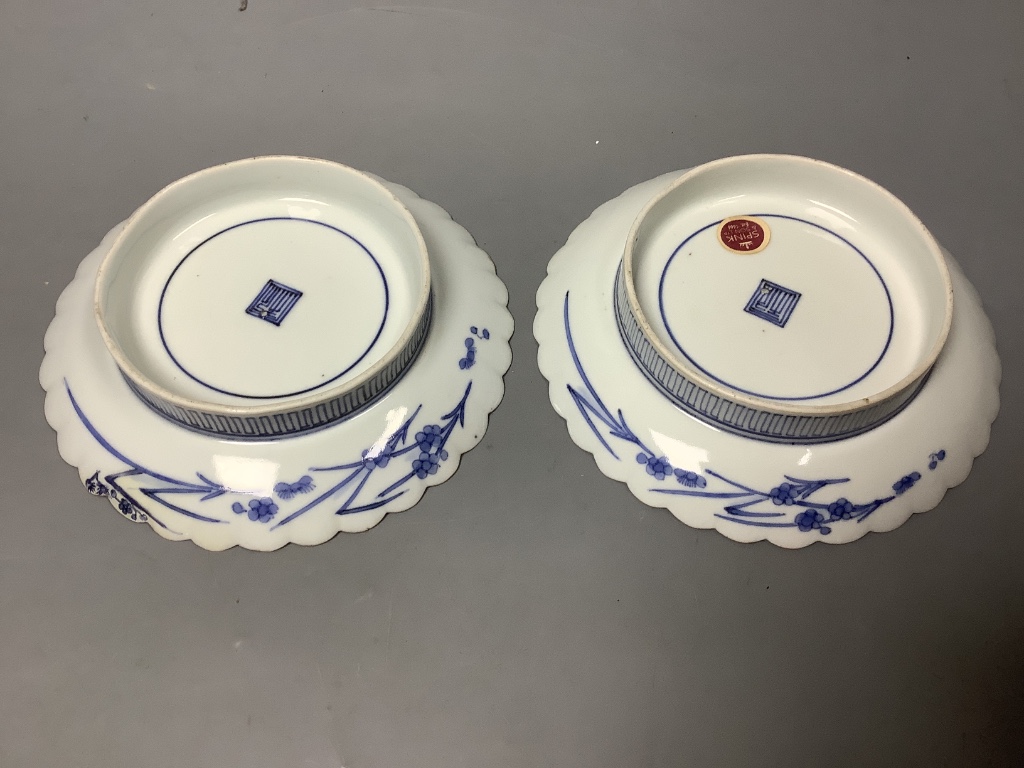 A pair of Japanese Kakiemon blue and white dishes, late 17th century, diameter 15cm, Spink & Son label